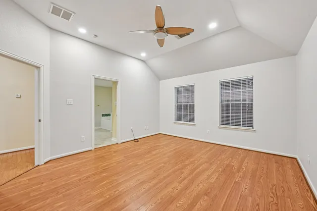 a view of front door of a house with potted plants