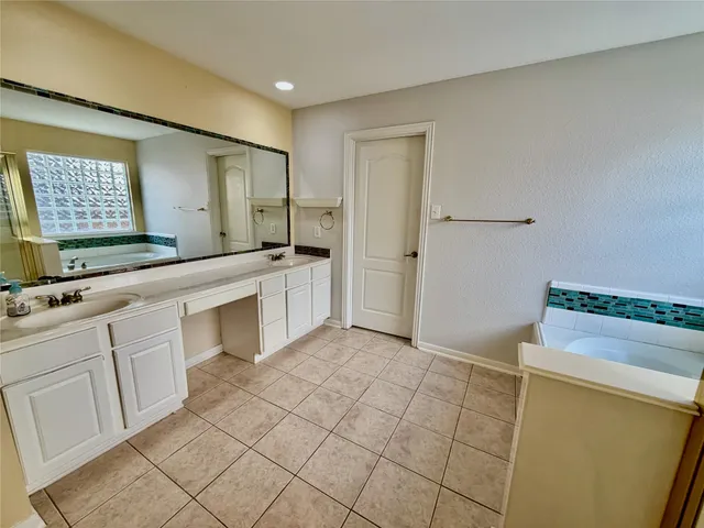a view of an empty room with window and fireplace