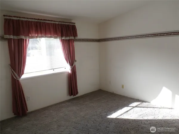 a view of walk in closet with window