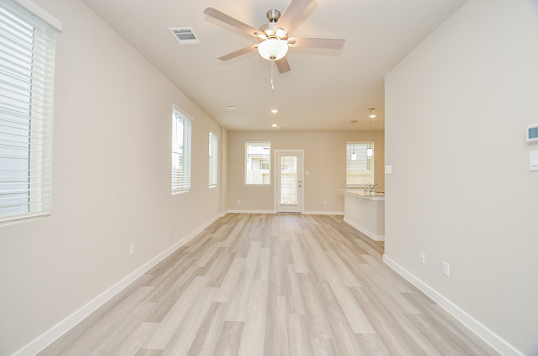 3107 Boulder Rnch Drive Houston, TX 77063 - Photo 10 of 40 wooden floor in an empty room with a window