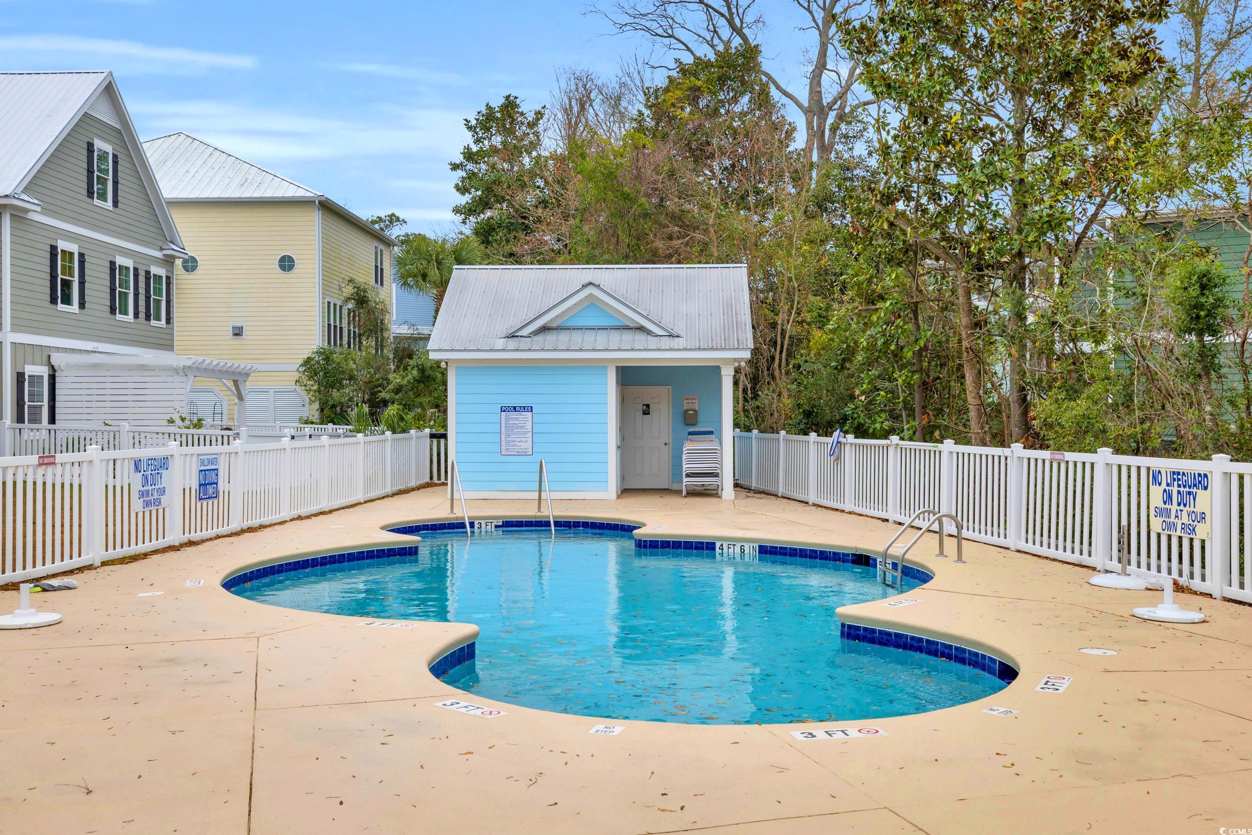 22 Trigger Fish Lane Murrells Inlet, SC 29576 - Photo 37 of 39 View of pool with a pergola, an outbuilding, and a patio