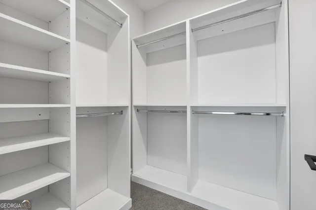 an aerial view of a house with a yard swimming pool and outdoor seating
