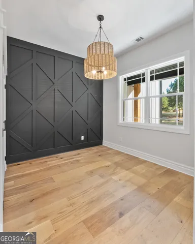 a bathroom with a sink a mirror and a shower
