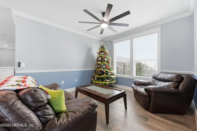 a kitchen with a stove a sink a microwave a dining table and chairs