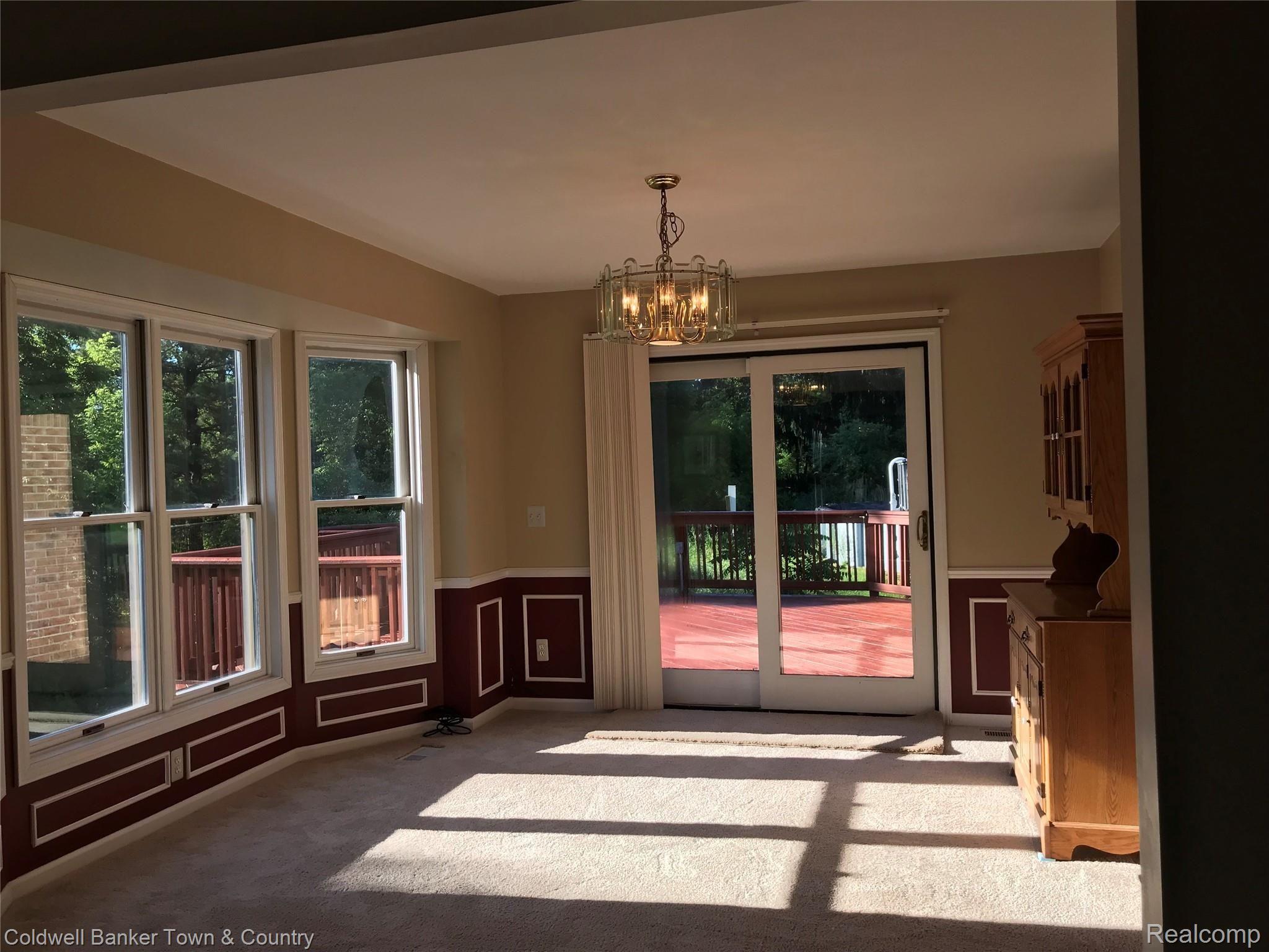 4400 Brighton Road Howell, MI 48843 - Photo 10 of 22 Formal dining room with access to deck