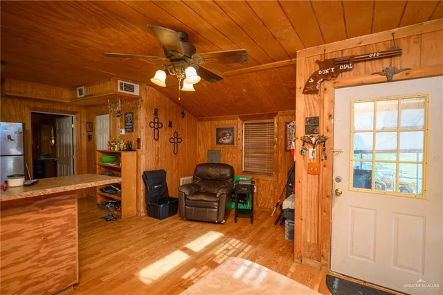 a view of a livingroom with furniture and a window