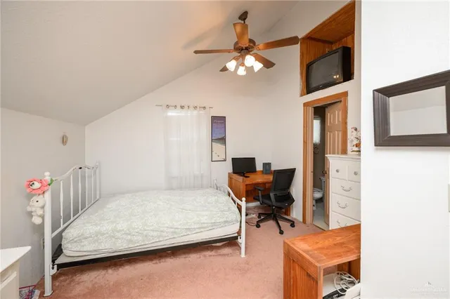 a bedroom with furniture and a chandelier