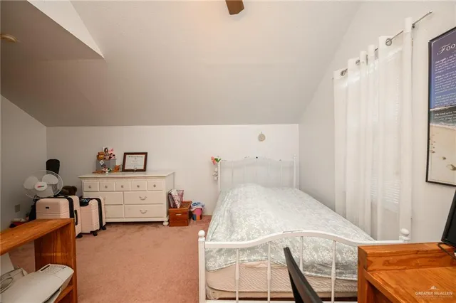 a bedroom with furniture and a chandelier