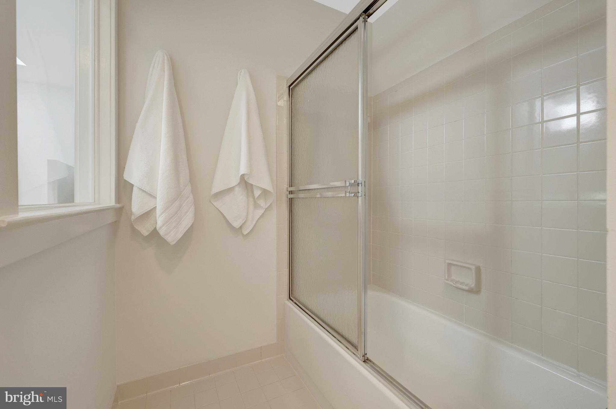 11024 Thrush Ridge Road Reston, VA 20191 - Photo 29 of 63 The primary bath has a ceramic tile shower/tub.