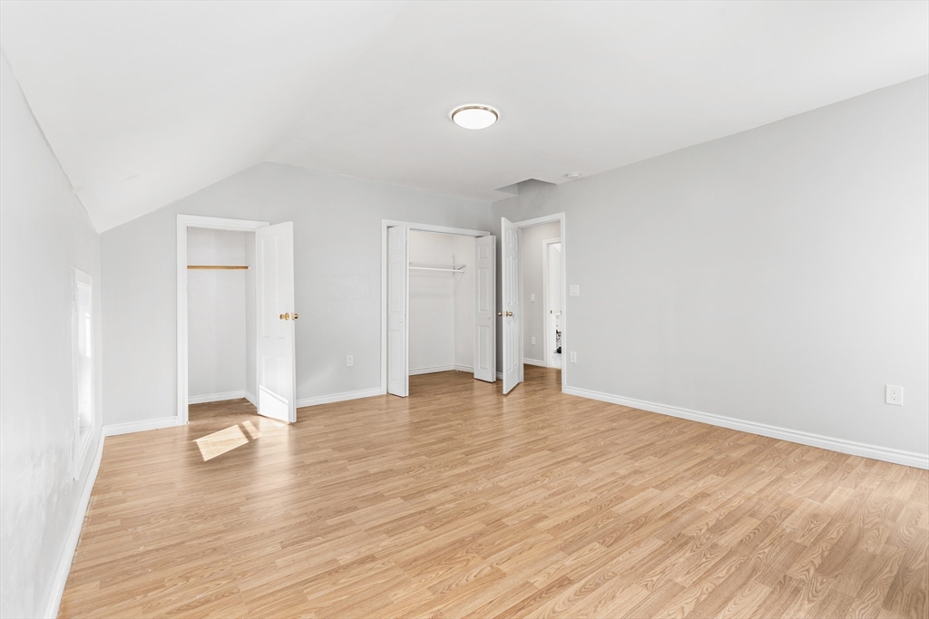502 4th Street Fall River, MA 02721 - Photo 12 of 34 a view of an empty room with wooden floor and a window