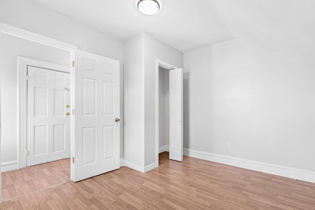 502 4th Street Fall River, MA 02721 - Photo 13 of 34 a view of an empty room with wooden floor