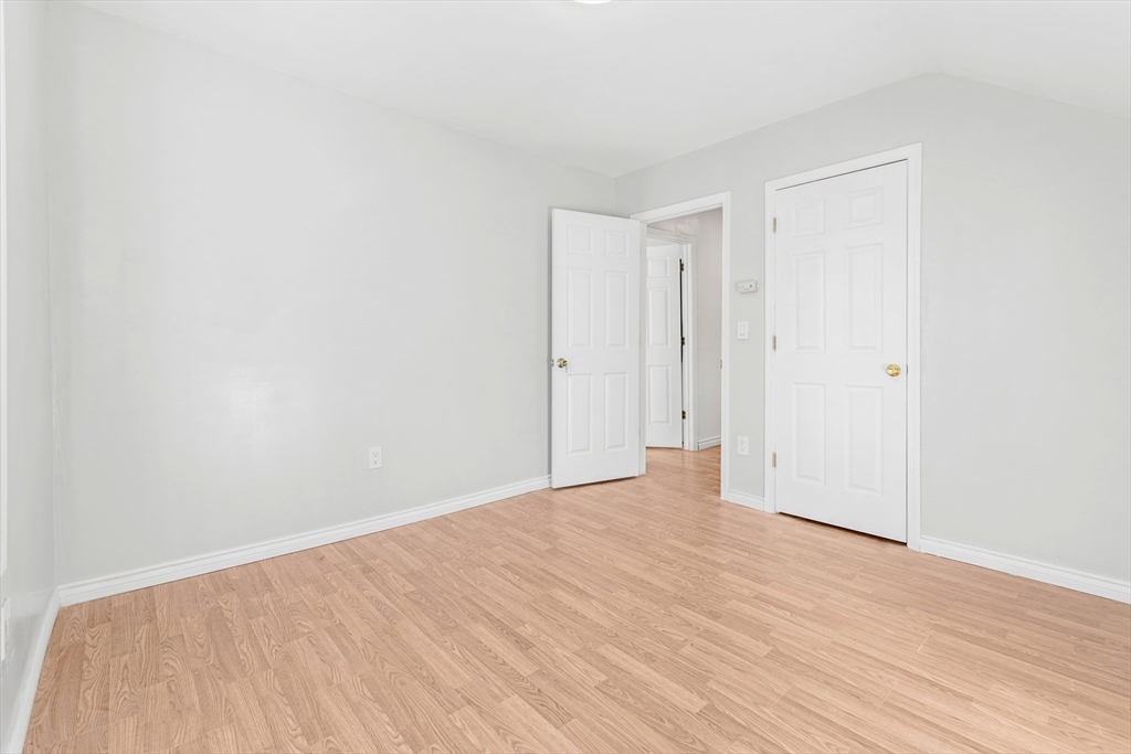502 4th Street Fall River, MA 02721 - Photo 15 of 34 a view of an empty room with wooden floor