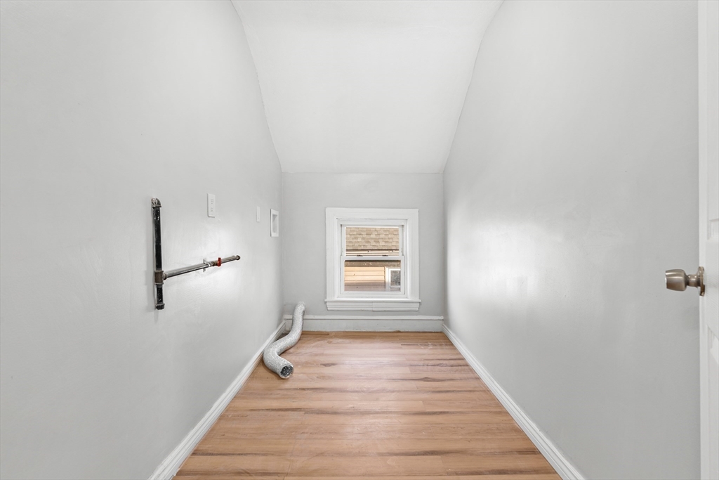 502 4th Street Fall River, MA 02721 - Photo 17 of 34 a view of a hallway with wooden floor