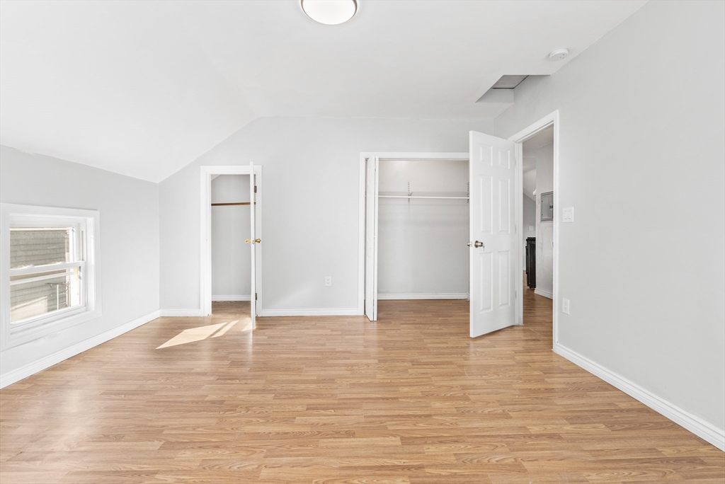 502 4th Street Fall River, MA 02721 - Photo 19 of 34 a view of an empty room with window and wooden floor
