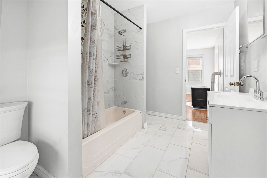 502 4th Street Fall River, MA 02721 - Photo 22 of 34 a bathroom with a sink a toilet and shower