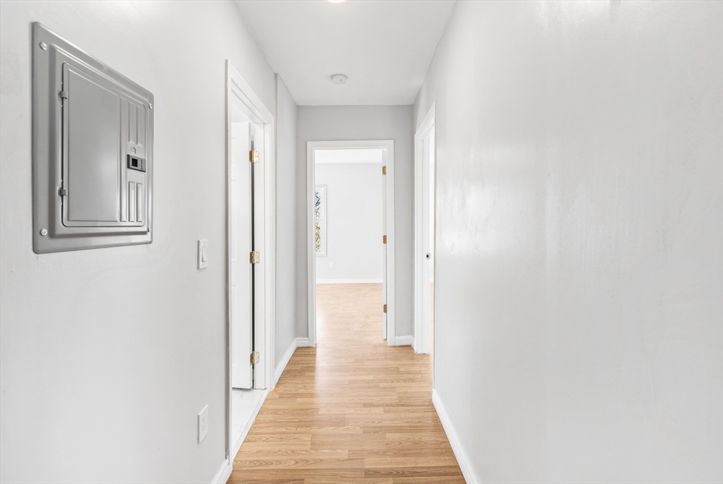 502 4th Street Fall River, MA 02721 - Photo 25 of 34 a view of a hallway with wooden floor