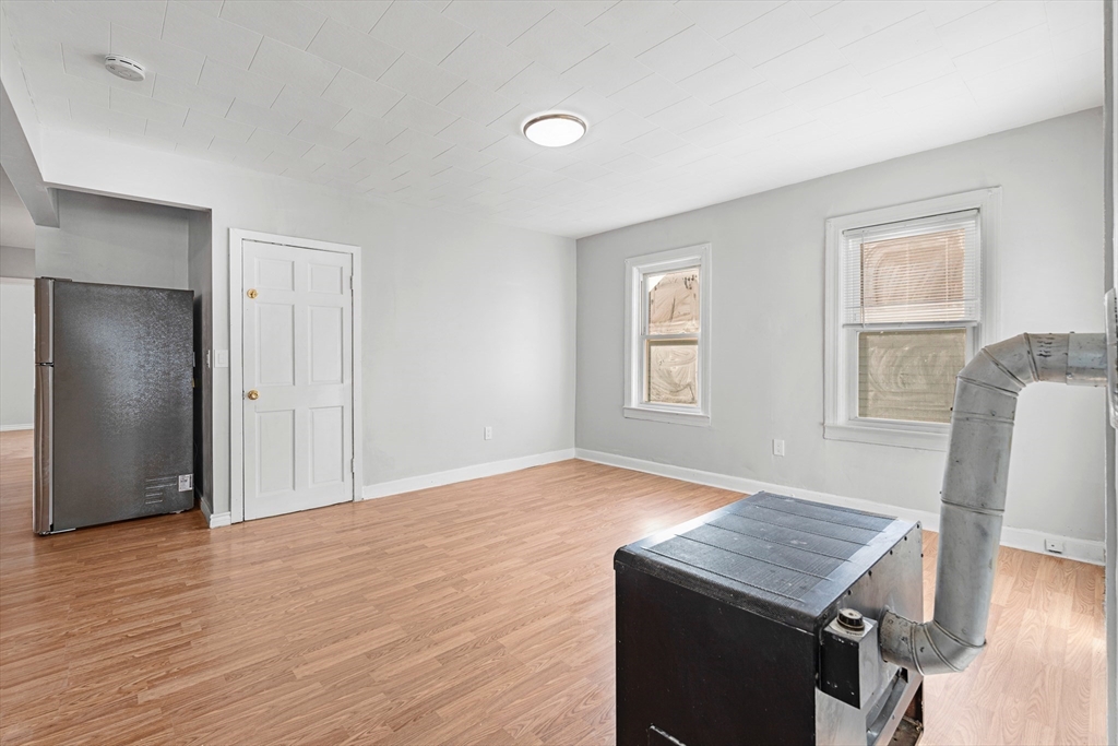 502 4th Street Fall River, MA 02721 - Photo 29 of 34 a view of kitchen with furniture and wooden floor