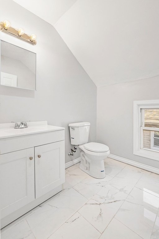 502 4th Street Fall River, MA 02721 - Photo 30 of 34 a bathroom with a toilet sink and a mirror