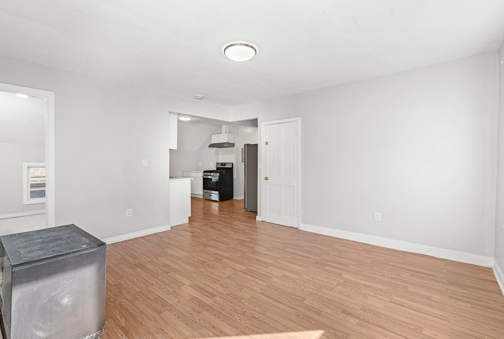 502 4th Street Fall River, MA 02721 - Photo 32 of 34 a view of empty room with wooden floor