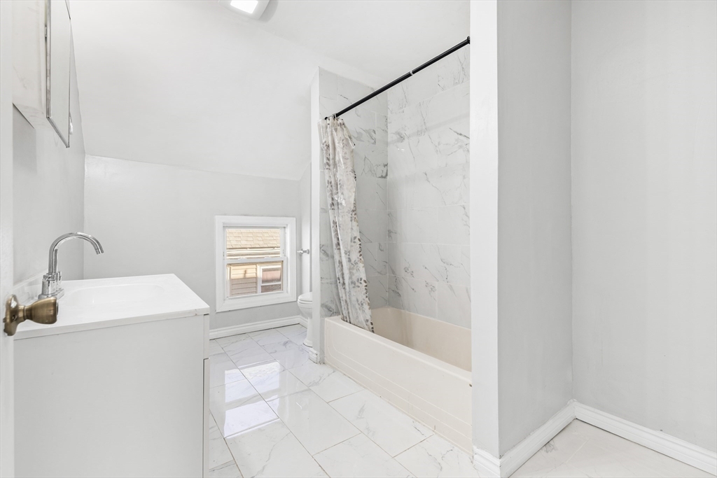 502 4th Street Fall River, MA 02721 - Photo 7 of 34 a bathroom with a shower and a sink