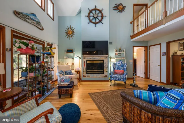 a living room with fireplace furniture and a flat screen tv