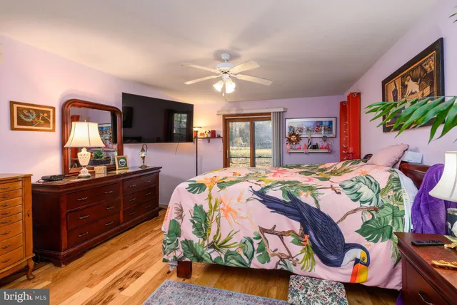 a bed room with a bed and a chandelier