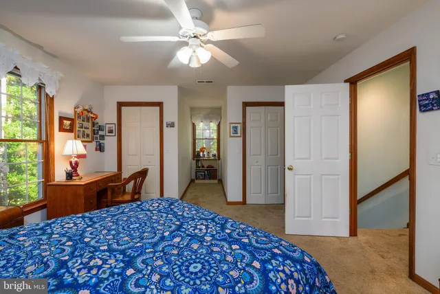 a living room with furniture and flat screen tv