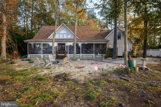 a view of lake with a large trees