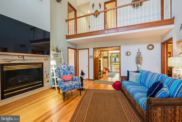 a living room with furniture or couch and a bookshelf
