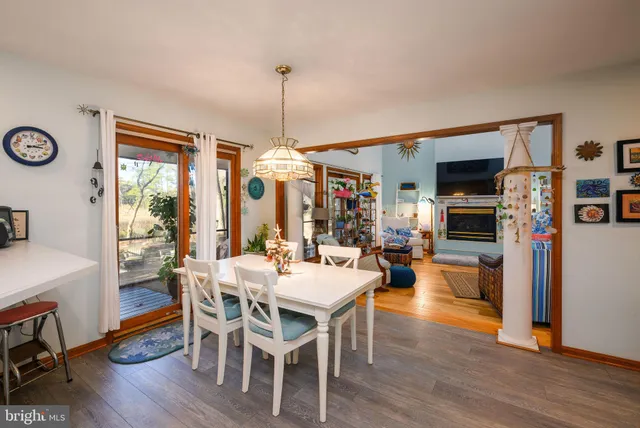 a large kitchen with a large window and stainless steel appliances