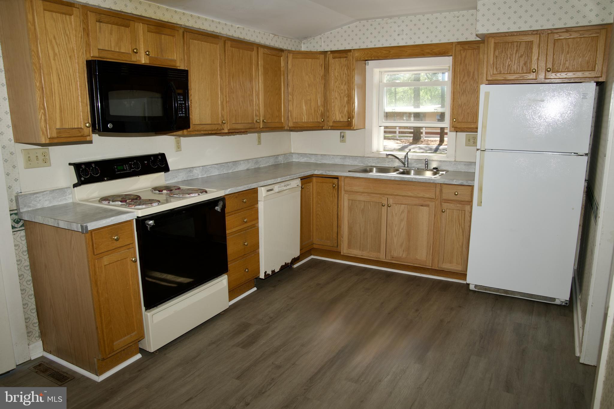 31867 Shavox Road Salisbury, MD 21804 - Photo 7 of 64 a kitchen with a sink stove and microwave