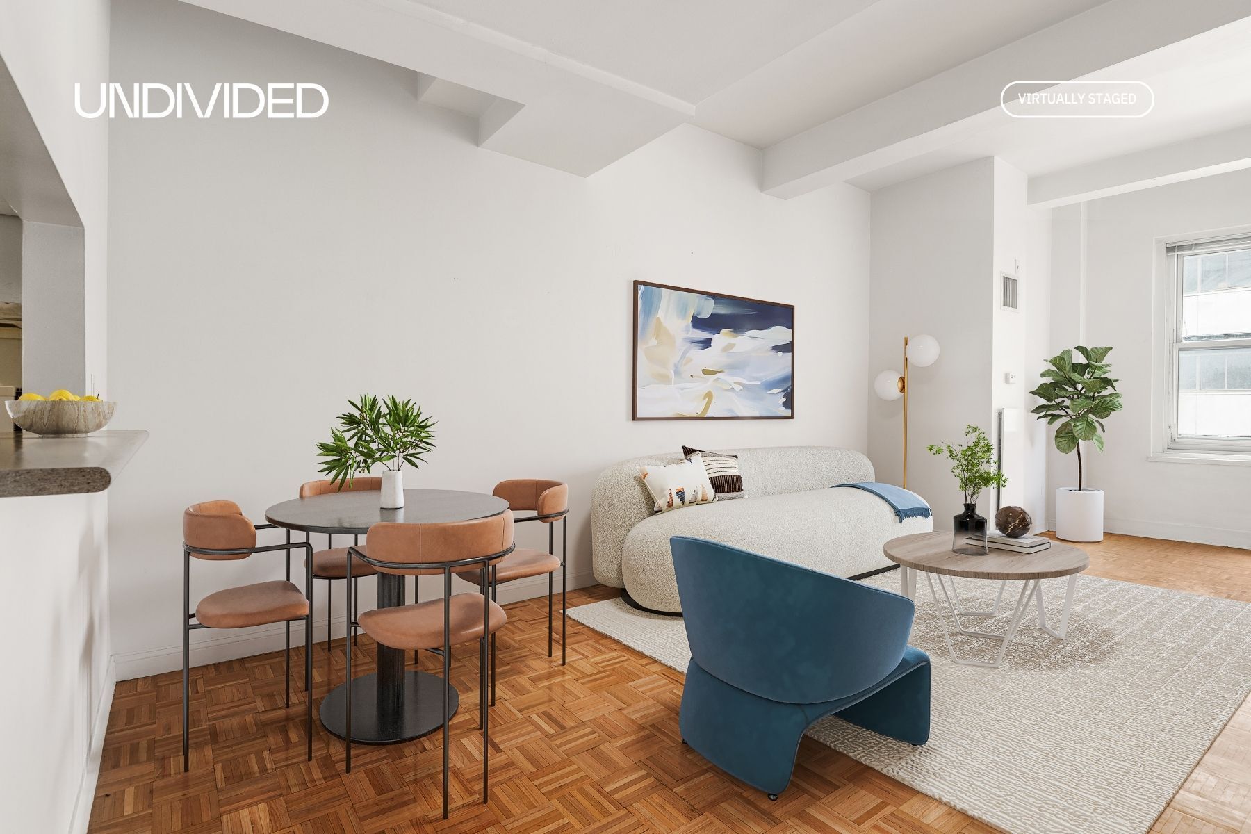 a living room with furniture and flowers