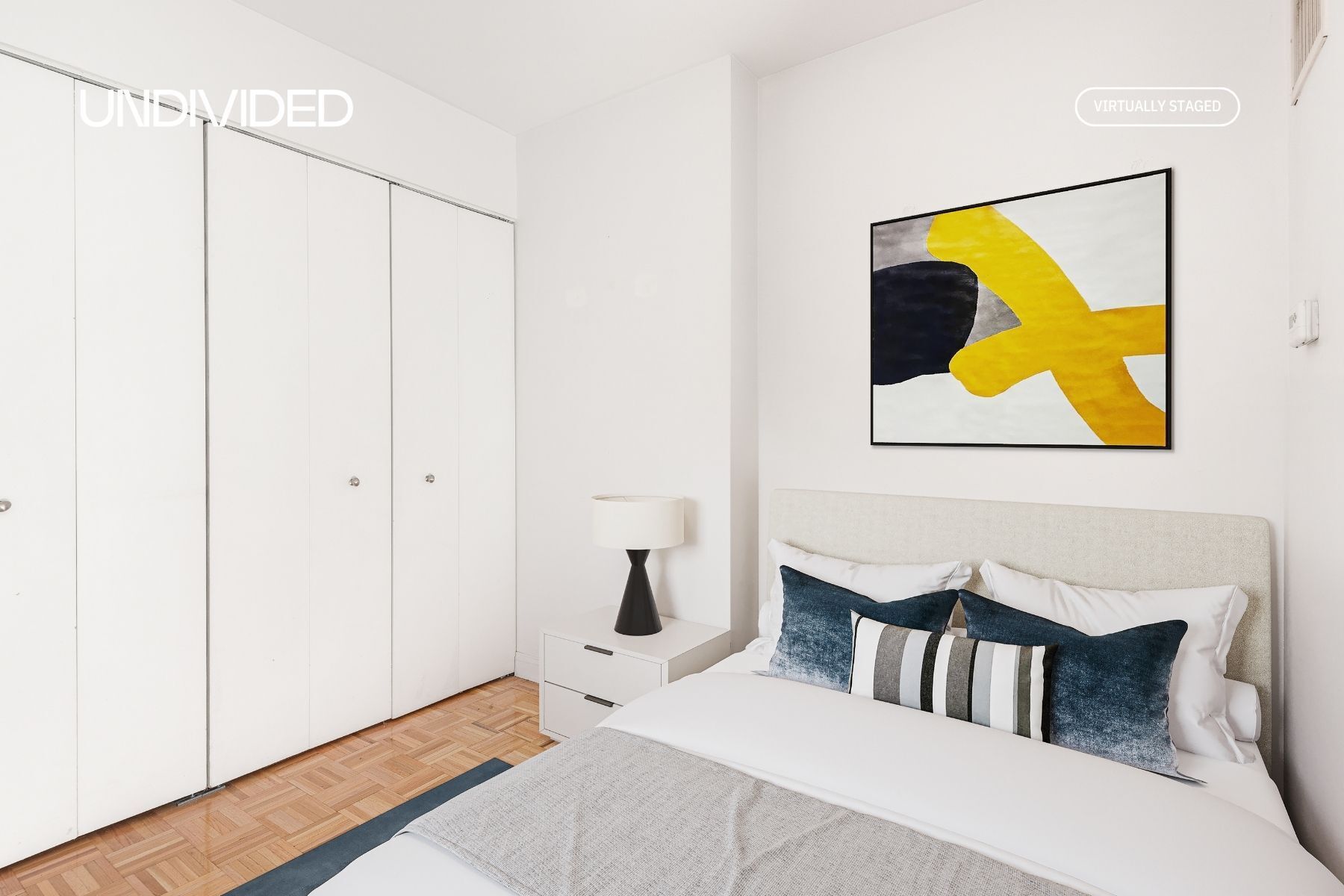 Undisclosed Address Manhattan, NY 10006 - Photo 3 of 9 a bedroom with a bed and painting on the wall