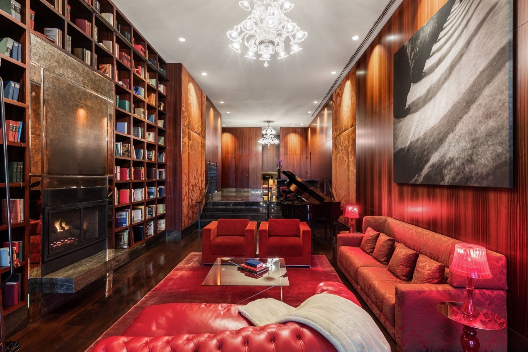 Undisclosed Address Manhattan, NY 10006 - Photo 6 of 9 a living room with furniture a lamp and a fireplace