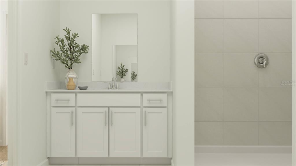 4249 Curacao Place Kissimmee, FL 34758 - Photo 15 of 30 a bathroom with a sink a vanity and a mirror