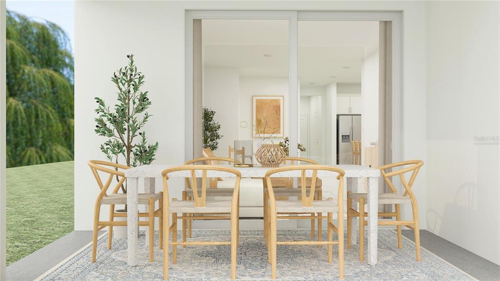 4249 Curacao Place Kissimmee, FL 34758 - Photo 19 of 30 a view of a dining room with furniture and chandelier