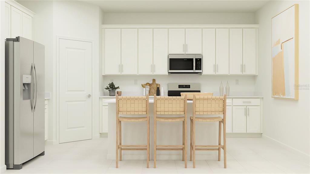 4249 Curacao Place Kissimmee, FL 34758 - Photo 2 of 30 a white kitchen with a sink and a refrigerator
