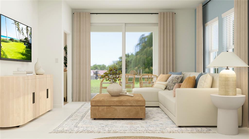 4249 Curacao Place Kissimmee, FL 34758 - Photo 7 of 30 a living room with furniture and a flat screen tv