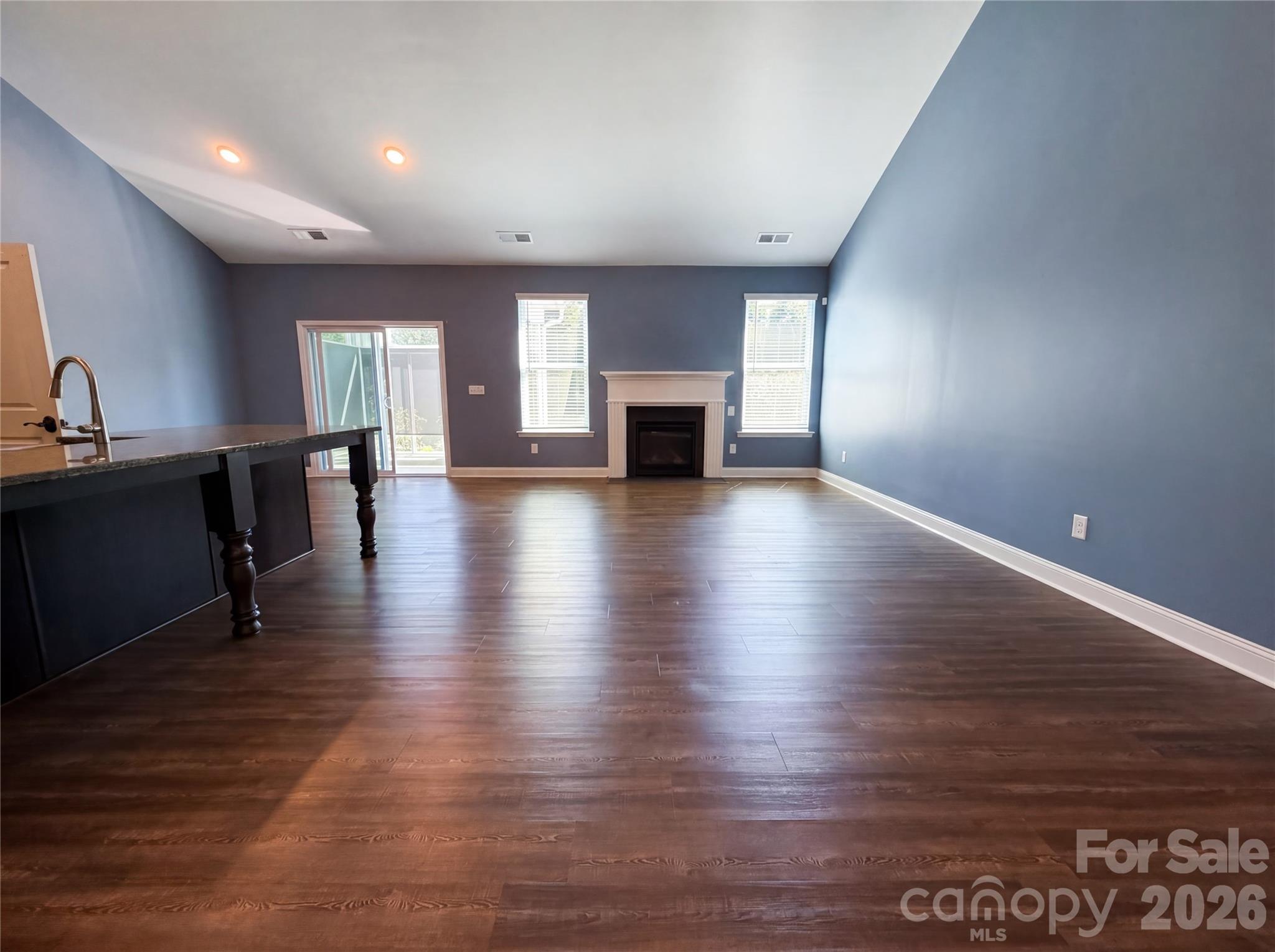 1321 Fishing Creek Road Clover, SC 29710 - Photo 3 of 19 a view of empty room with wooden floor and fireplace