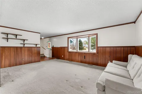 a view of a livingroom with furniture and window