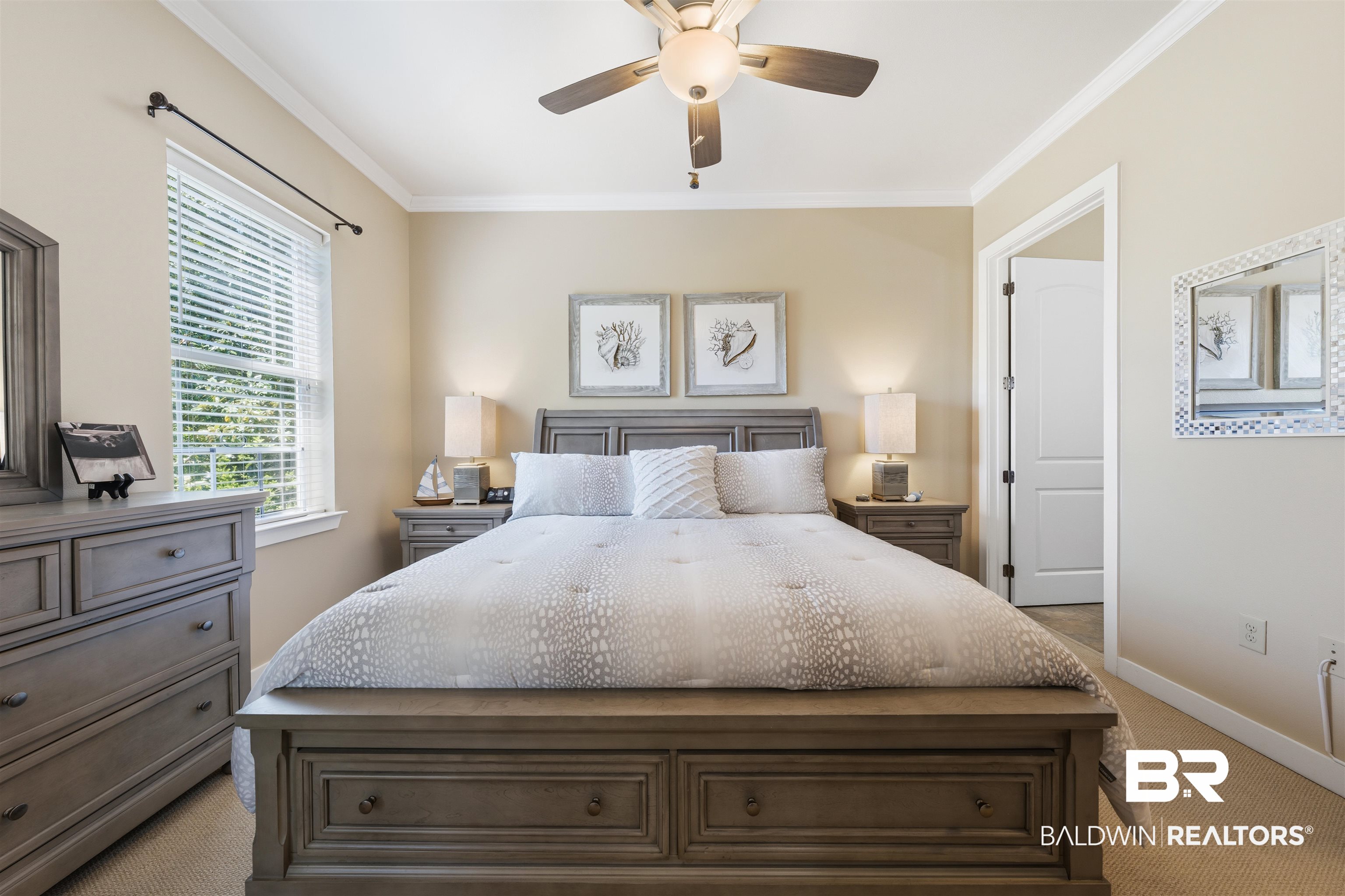 1430 Regency Road, Unit H202 Gulf Shores, AL 36542 - Photo 9 of 25 Carpeted bedroom featuring crown molding and a ceiling fan