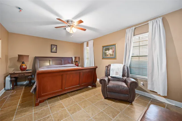 a bedroom with a bed and window