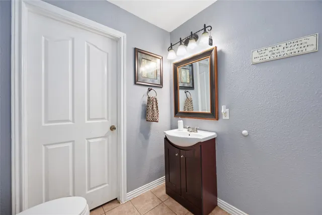 a bathroom with 2 sink and a mirror