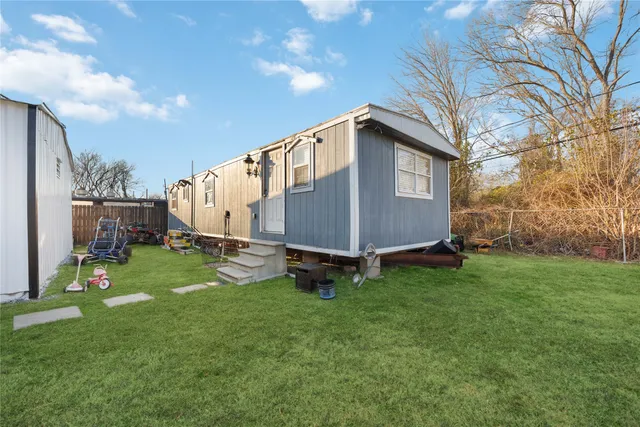 a backyard of a house with lots of green space