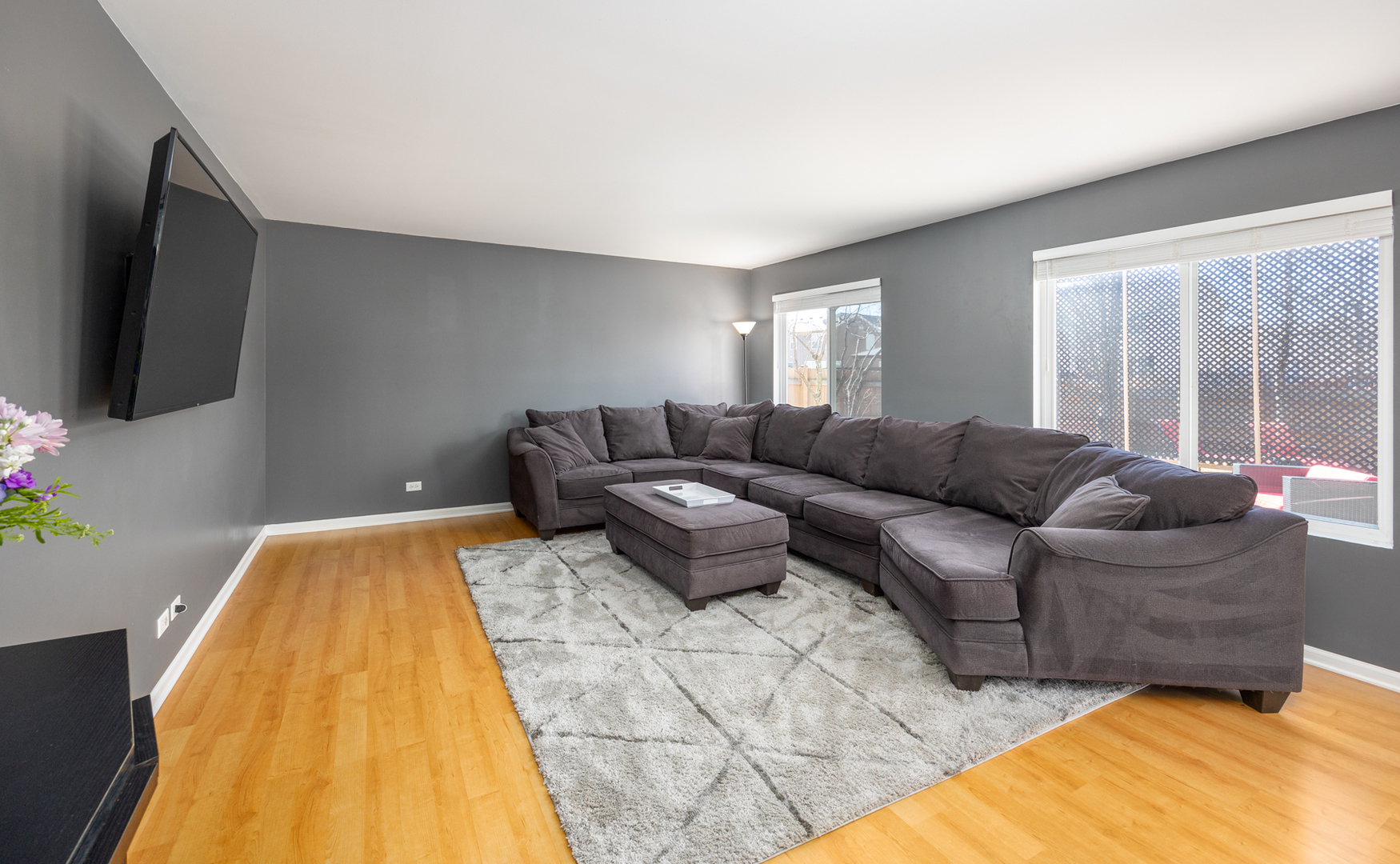 754 Beethoven Street Volo, IL 60073 - Photo 3 of 32 a living room with couches and a flat screen tv