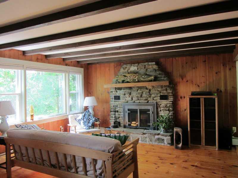 89 Lakeview Road Boothbay Harbor, ME 04575 - Photo 22 of 28 Living Room. Cozy ambience with wood...