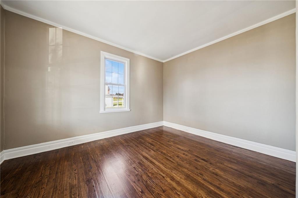 1908 Walnut Drive Latrobe, PA 15650 - Photo 14 of 34 a view of an empty room with wooden floor and a window