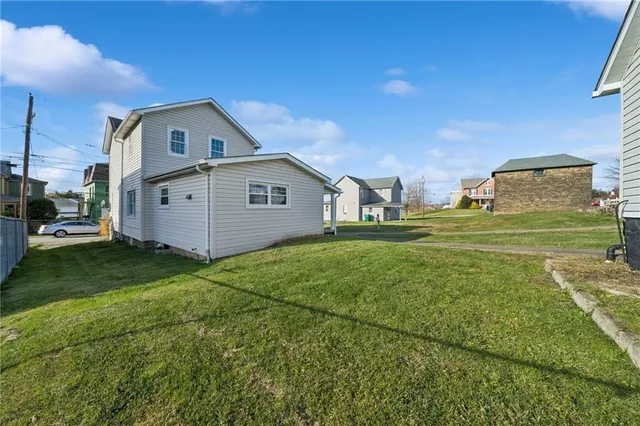 a view of a house with a back yard