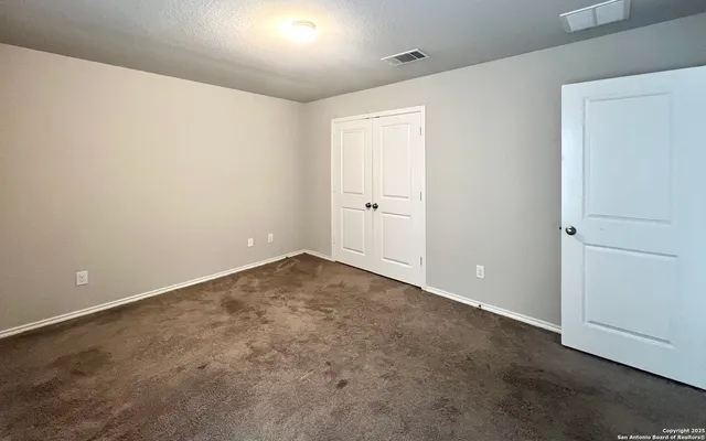 an empty room with a empty space and window