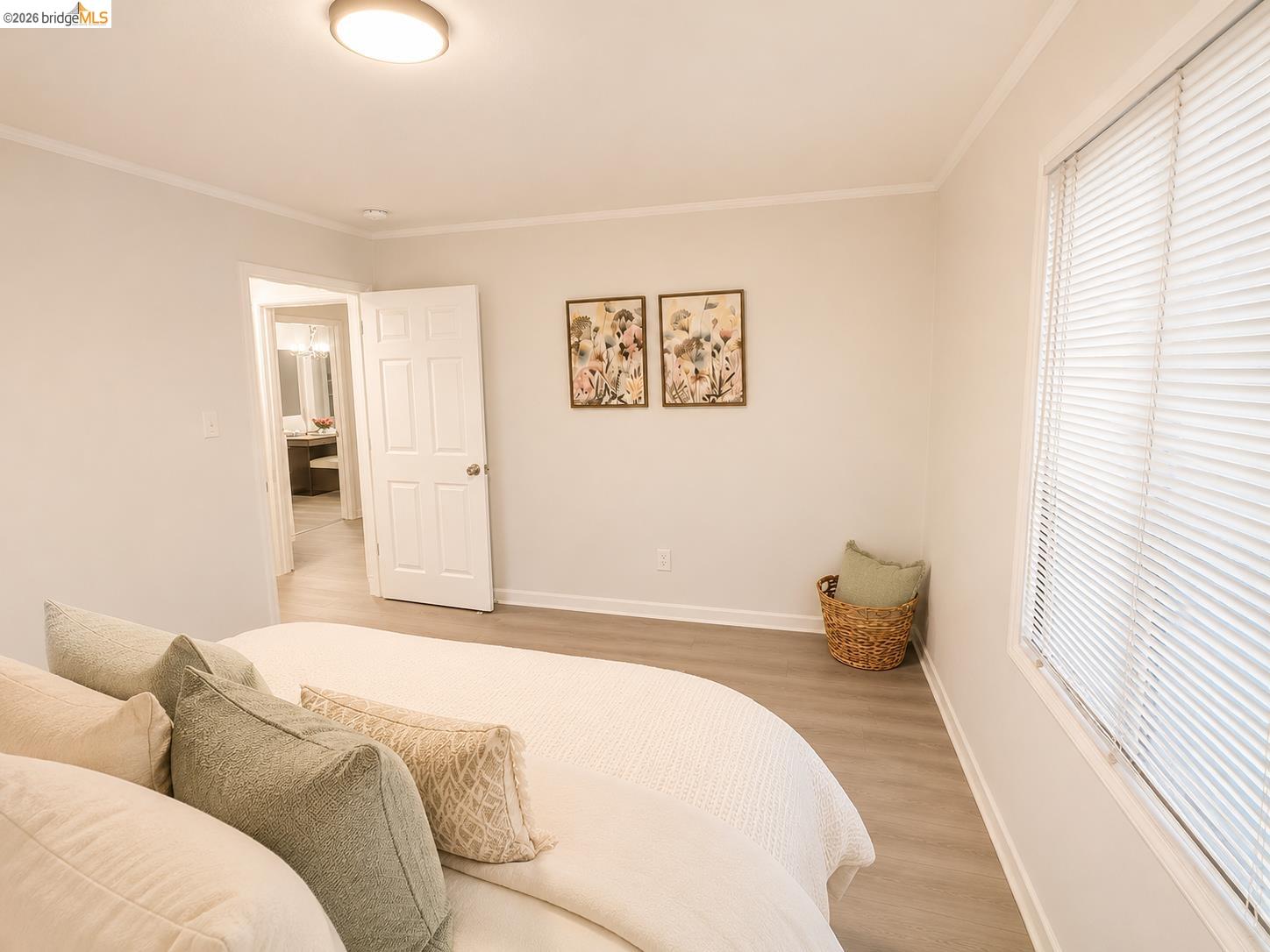 810 Pierce Street Albany, CA 94706 - Photo 9 of 25 Spacious room featuring light wood-finish flooring, white baseboards, and a large window with horizontal blinds